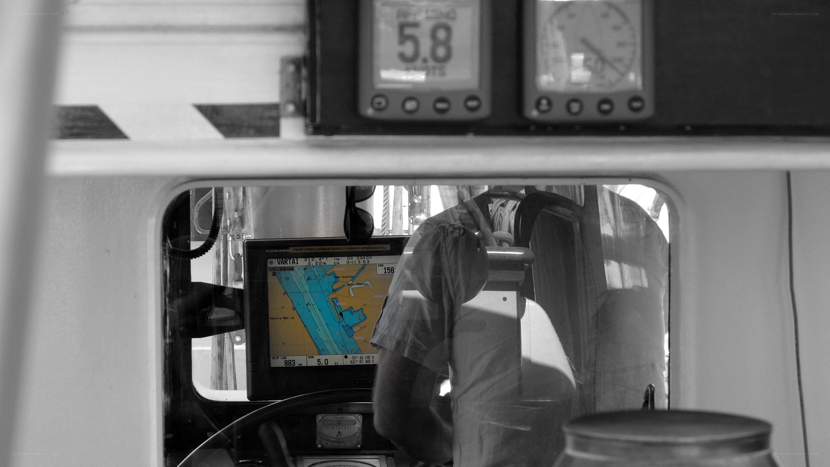 Captain at helm on boat