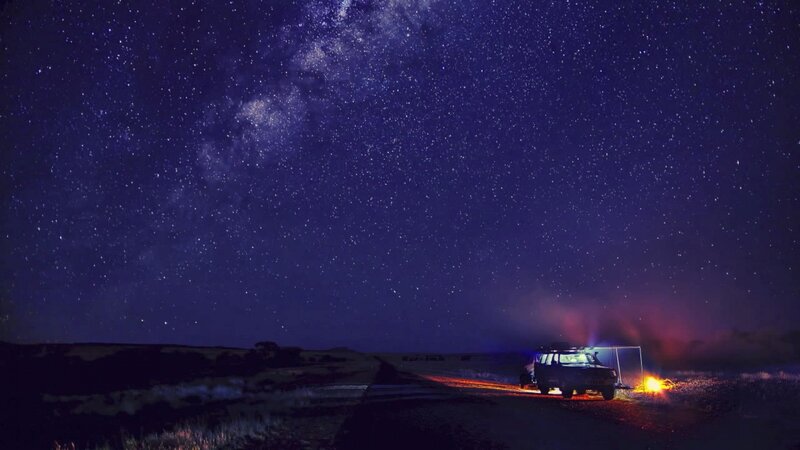 Car and Campfire under Stars