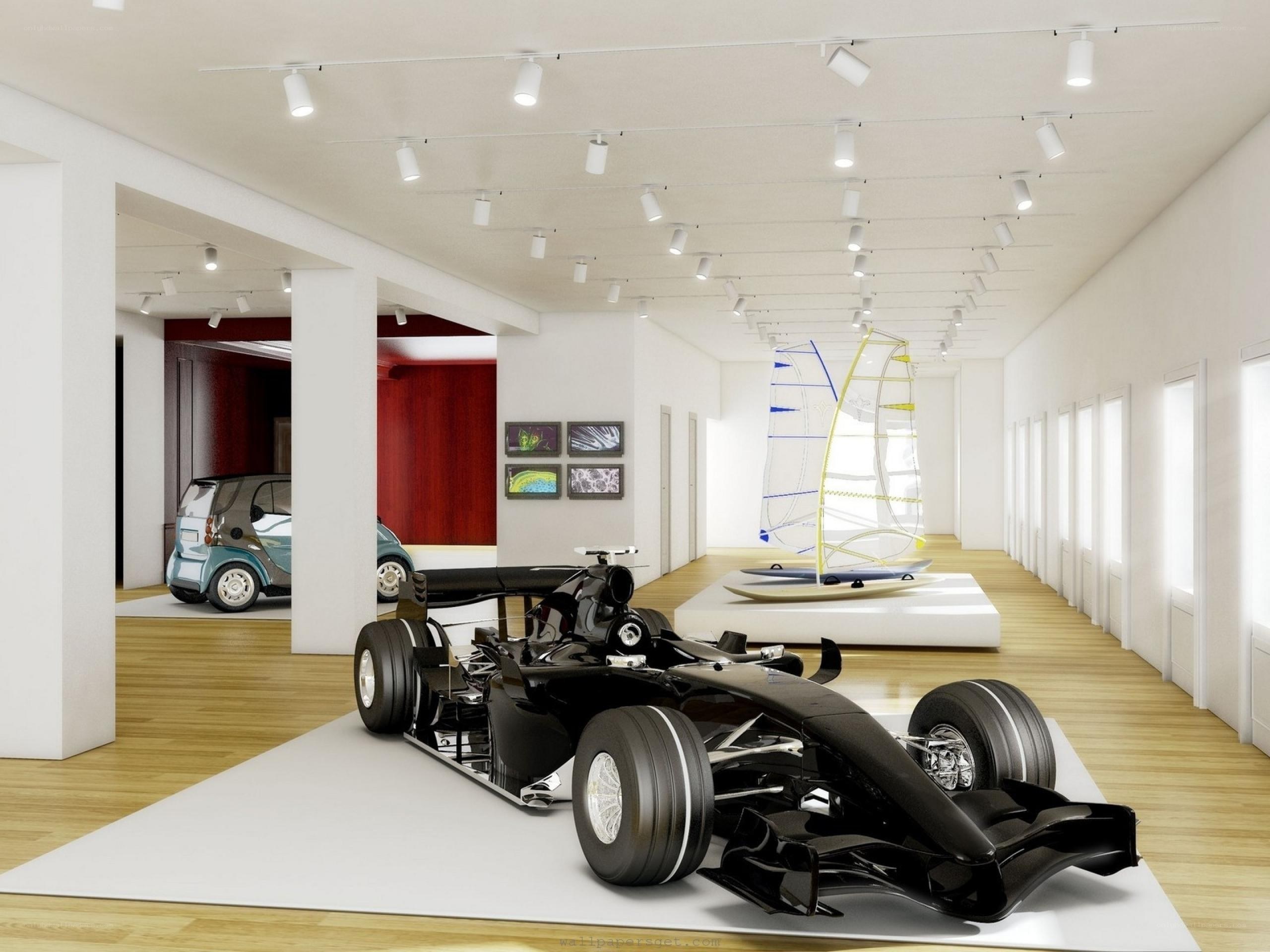 Car and sailboat models in gallery