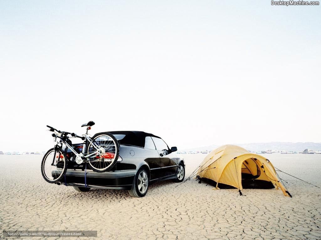 Car and tent in desert