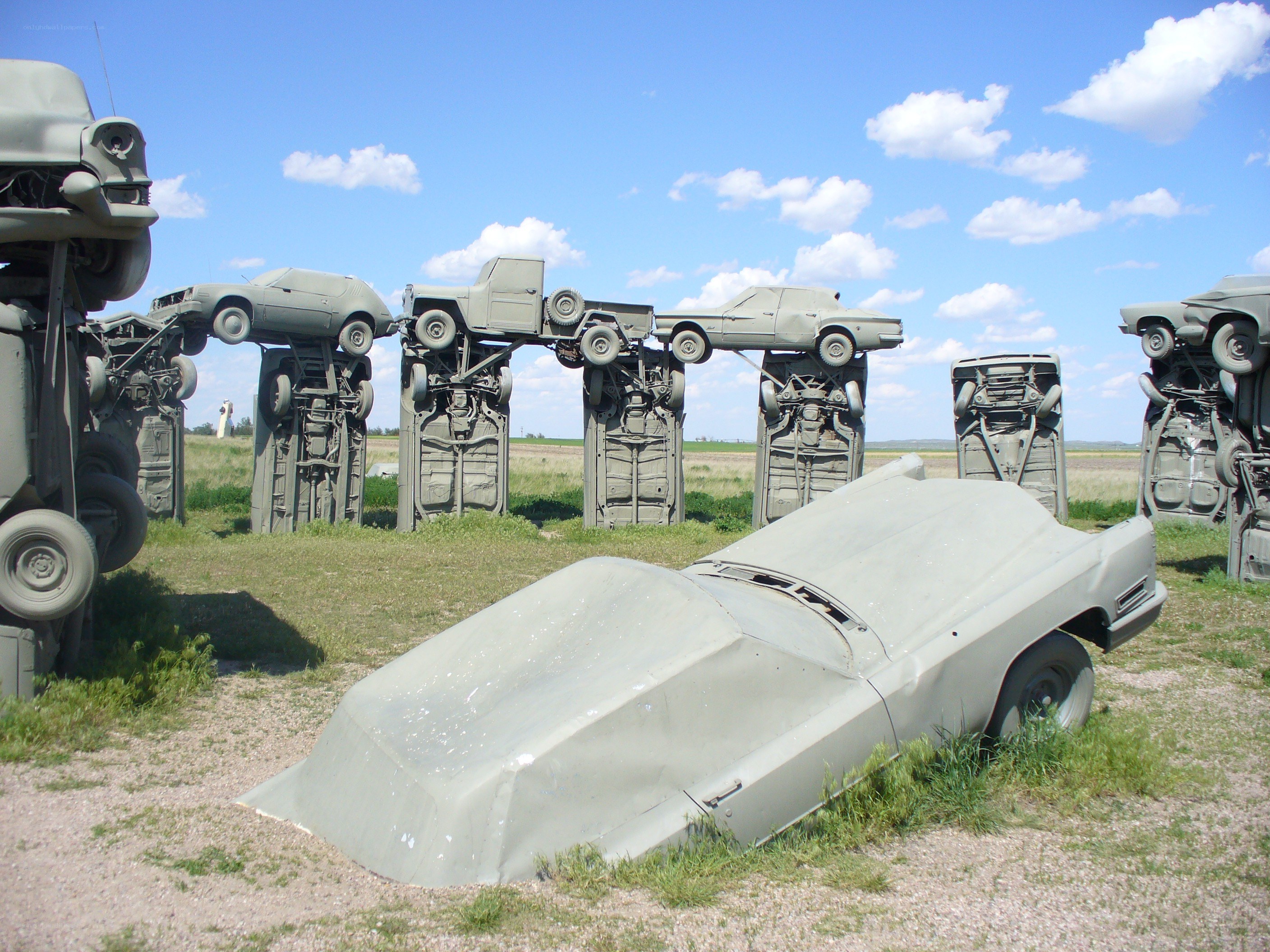 Car art installation in a field