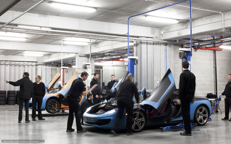 Car assembly line team at work