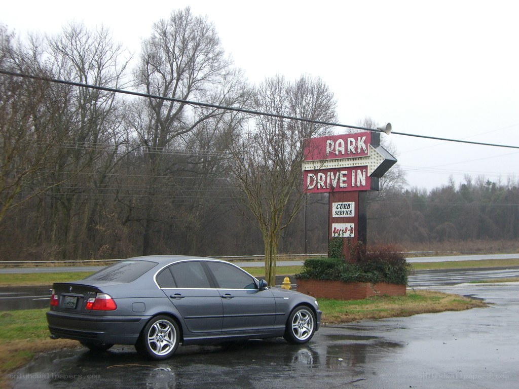 Car at a drive-in sign