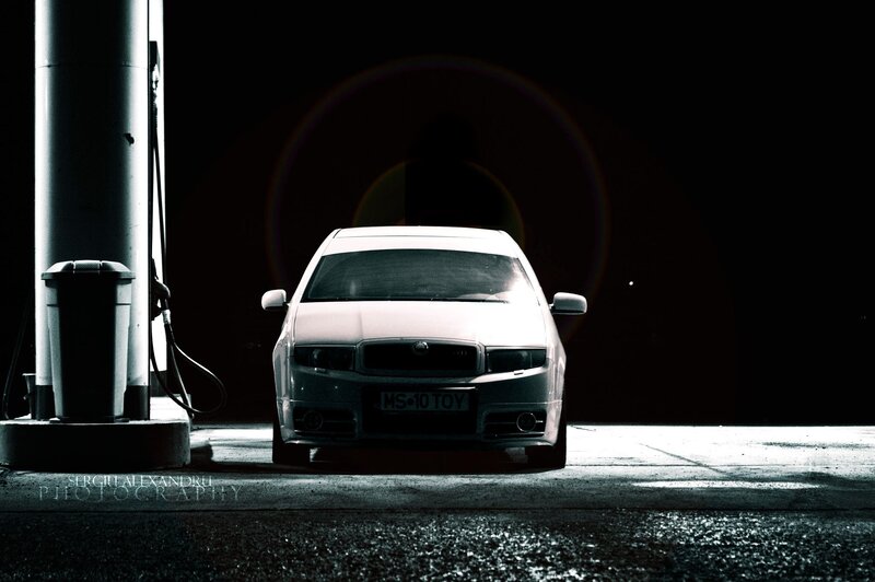 Car at a gas station at night