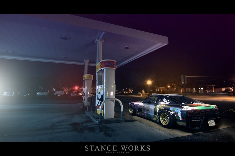 car at gas station at night