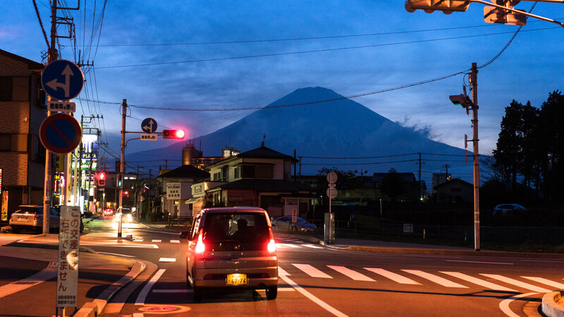 Car at Intersection with Mountain