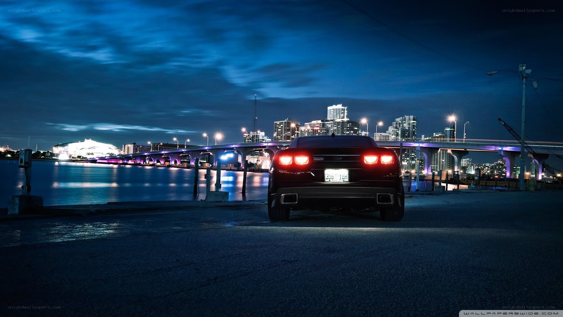 Car at night by the city