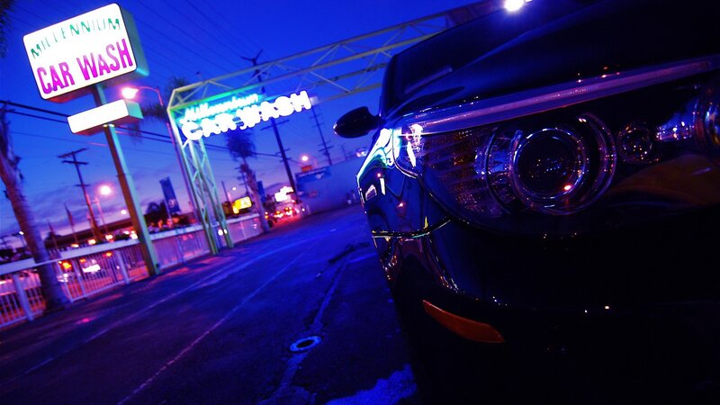 Car at night near car wash