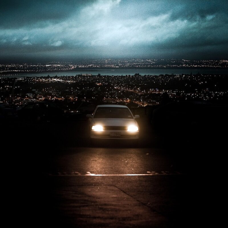 Car at night with city view