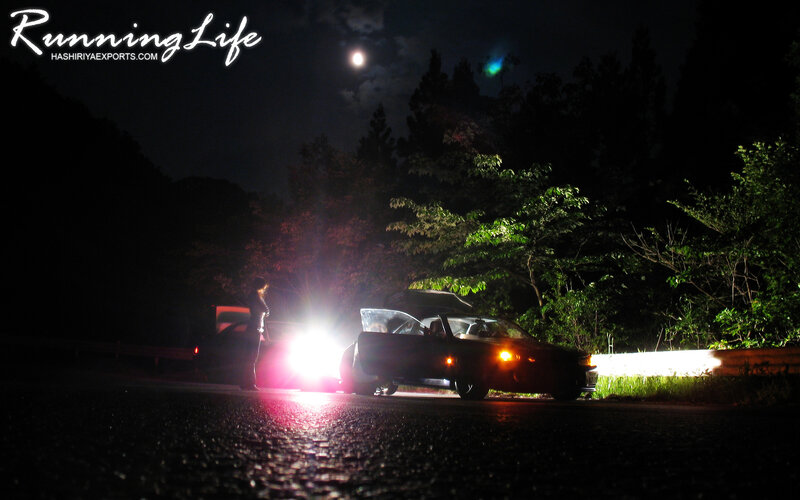 Car at night with headlights on