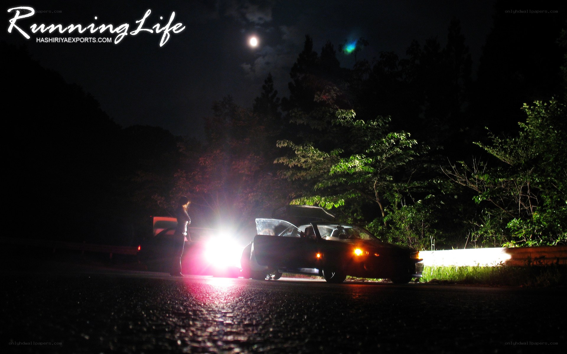 Car at night with headlights on