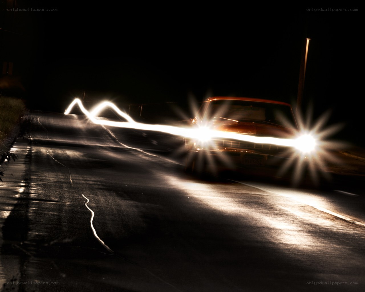 Car at night with light trails