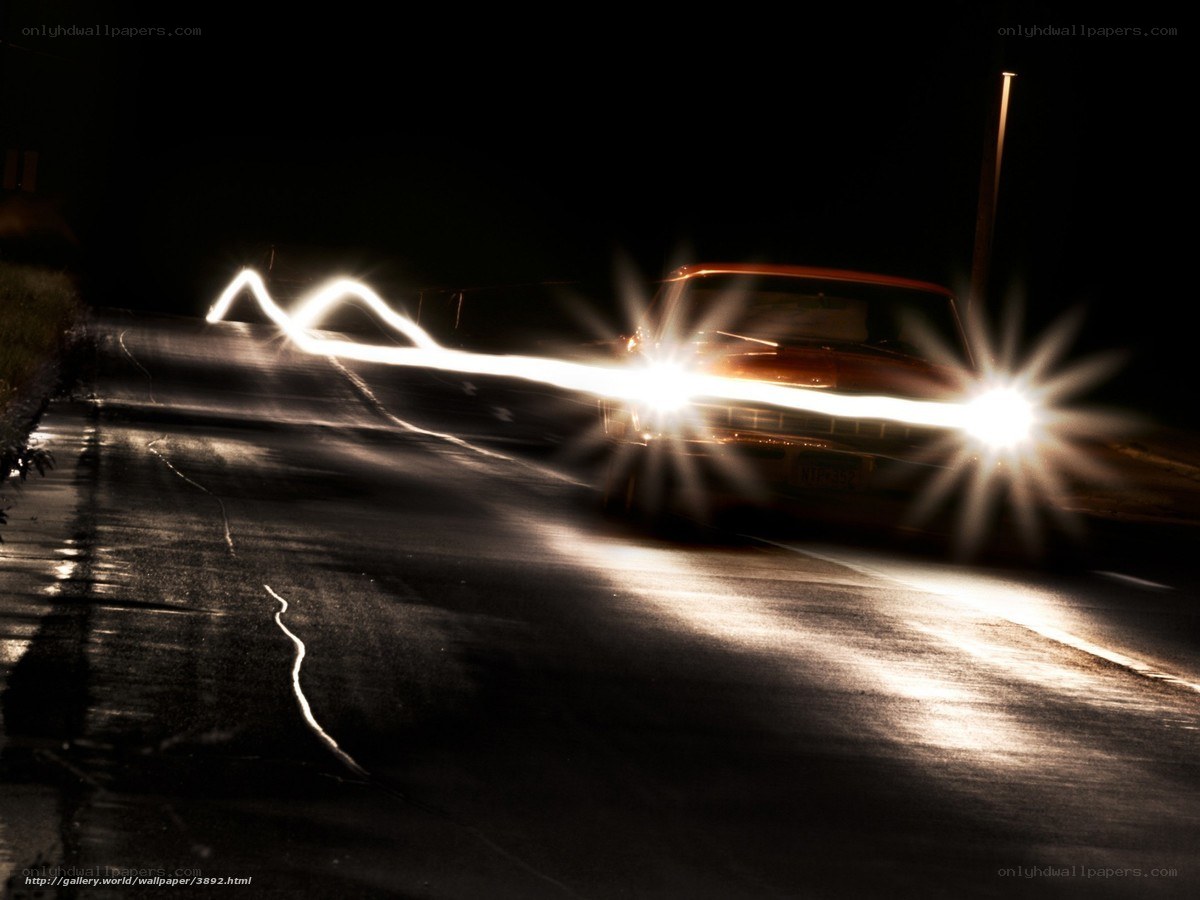 Car at night with light trails