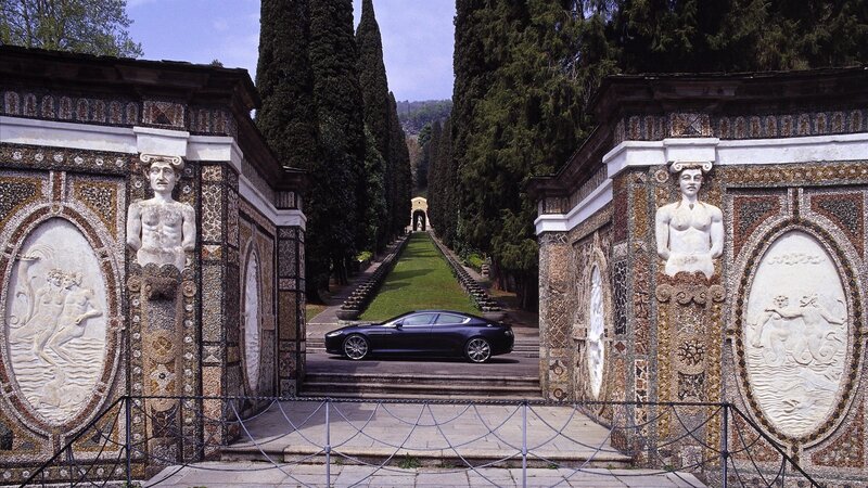 Car at ornate garden entrance