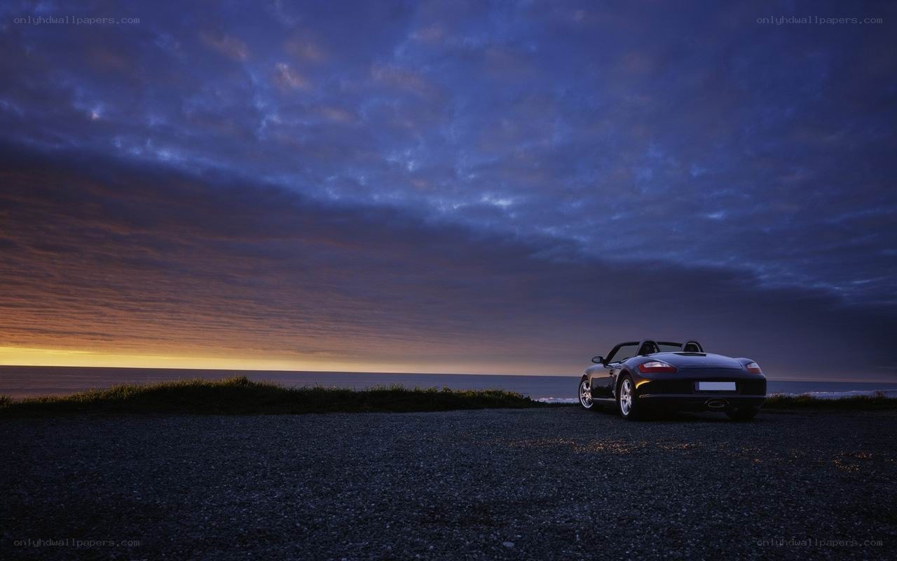 Car at sunset by the sea