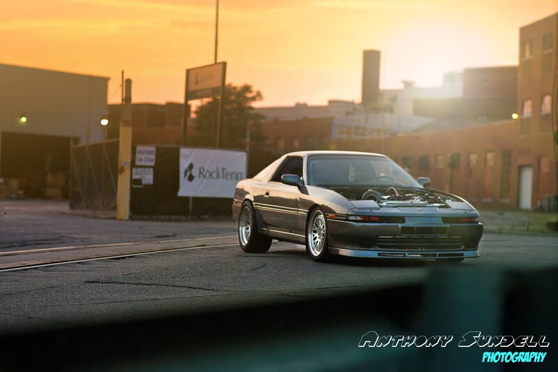 car at sunset in industrial area