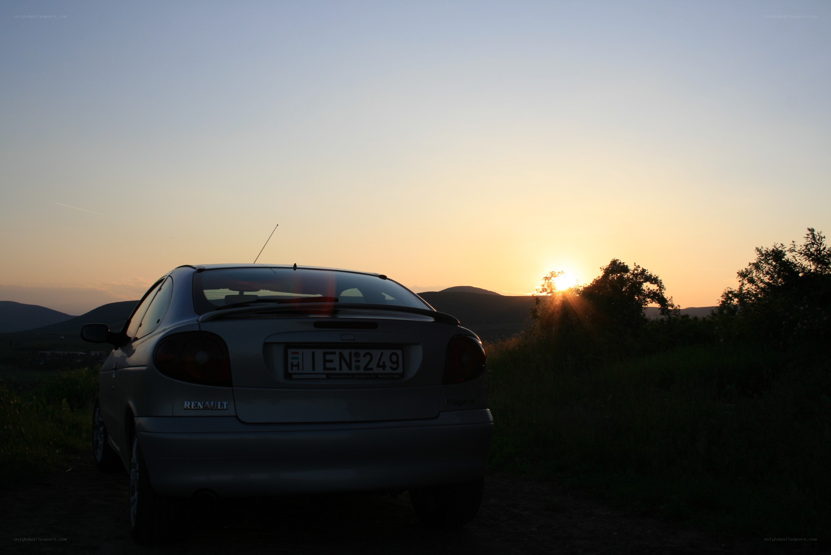 Car at sunset in the countryside