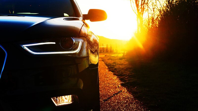 car at sunset on a country road