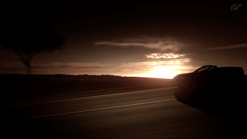 Car at sunset on a road