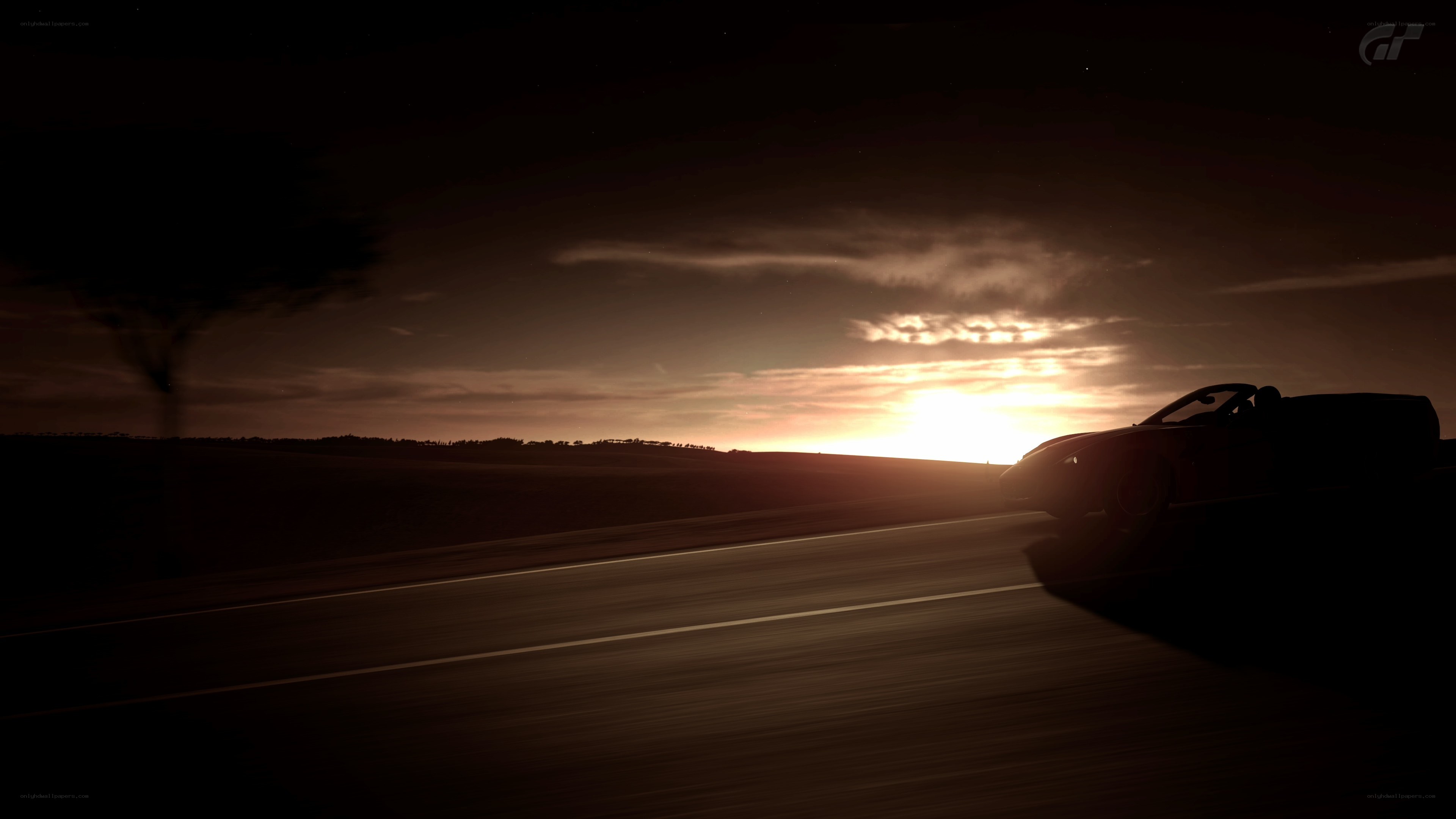 Car at sunset on a road