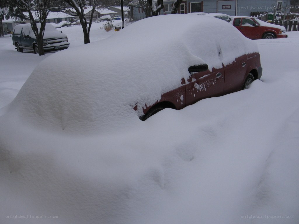 Car buried in snow