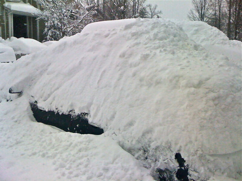 Car buried in snow