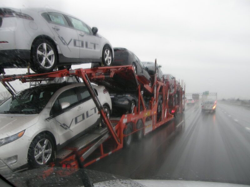 Car carrier on a rainy highway