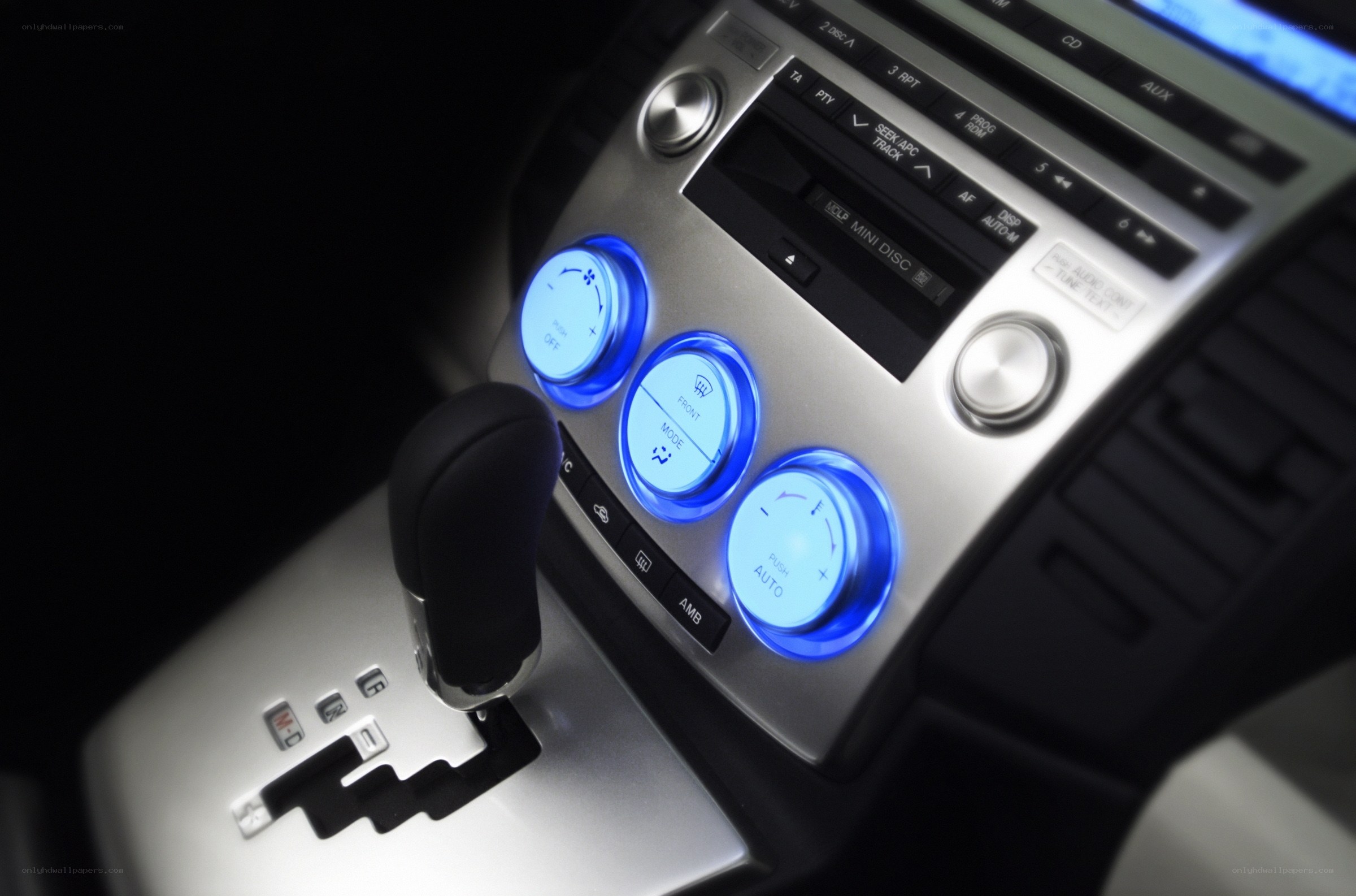 car center console with blue lights
