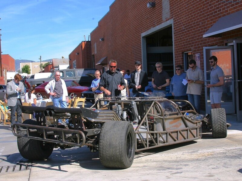 Car chassis on display outdoors