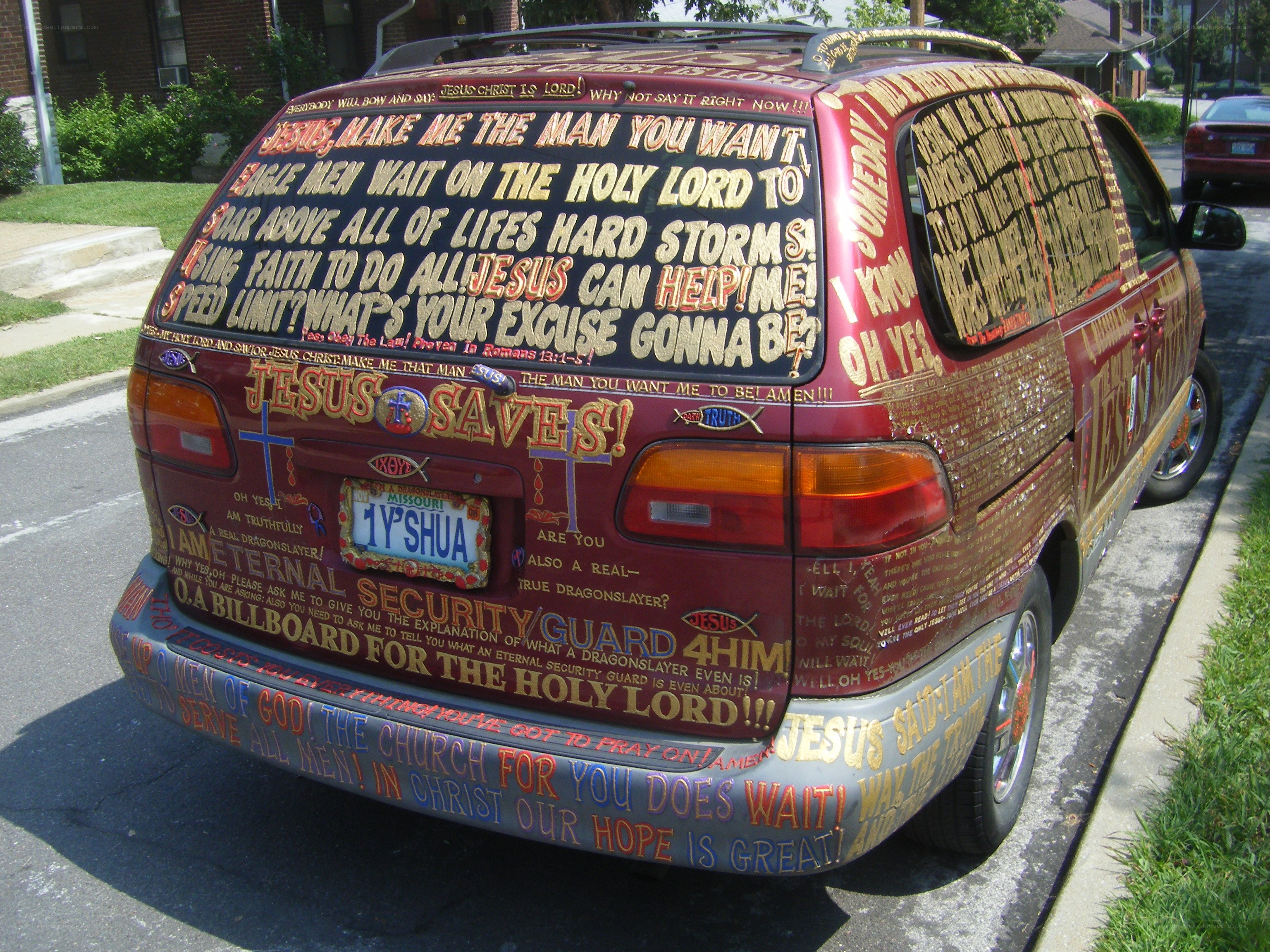 car covered in religious text