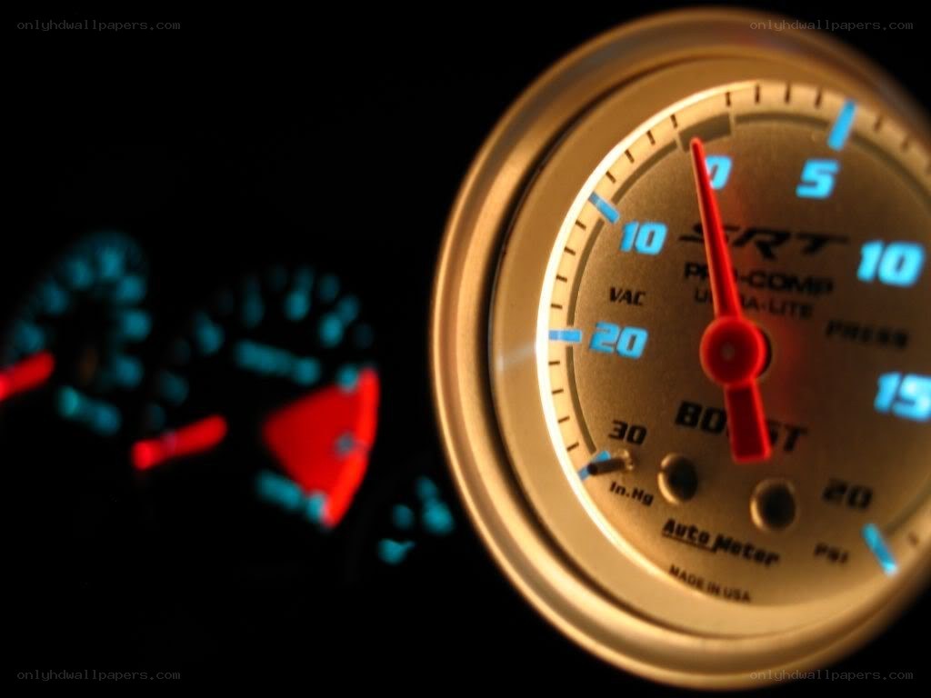 car dashboard gauges at night