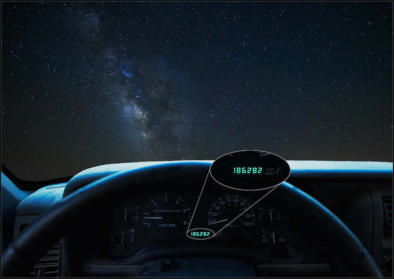 Car dashboard under starry sky
