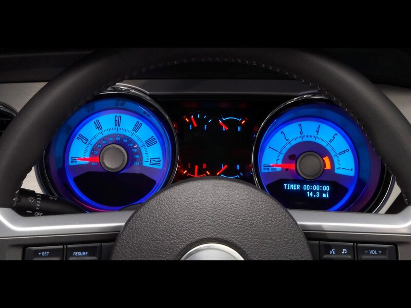 car dashboard with blue gauges