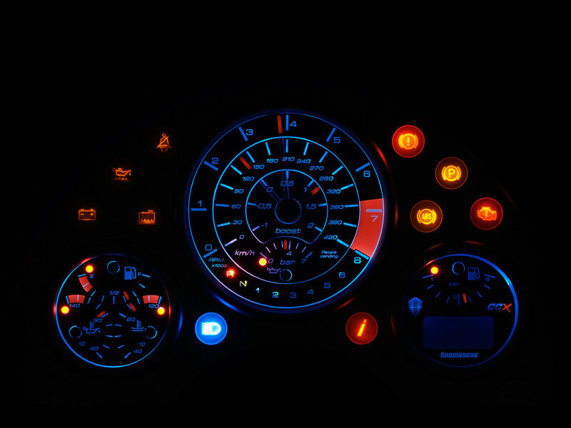 car dashboard with glowing gauges