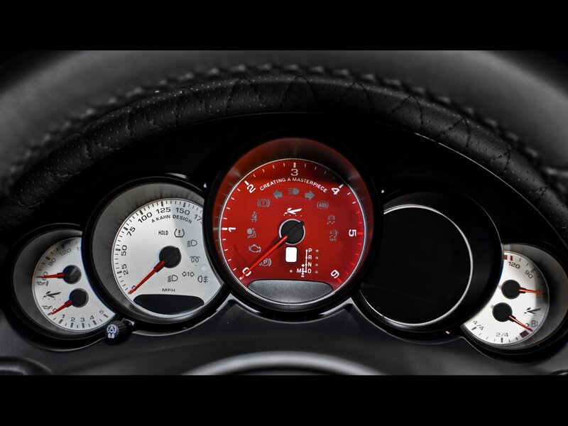 car dashboard with red tachometer