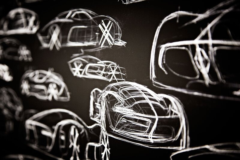 Car design sketches on blackboard