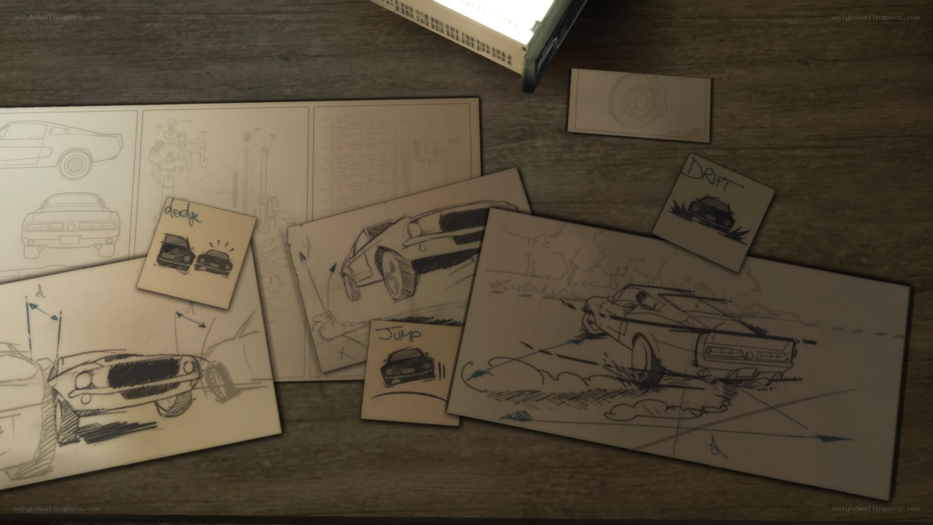 car design sketches on desk