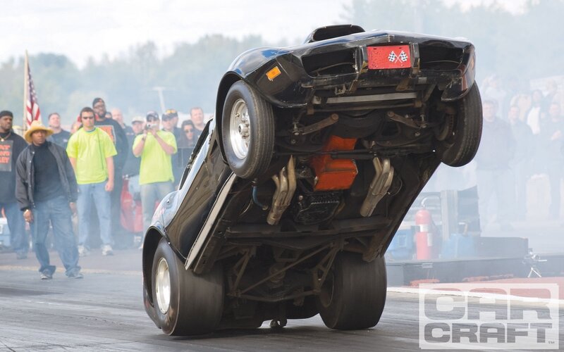 Car doing a wheelie on track