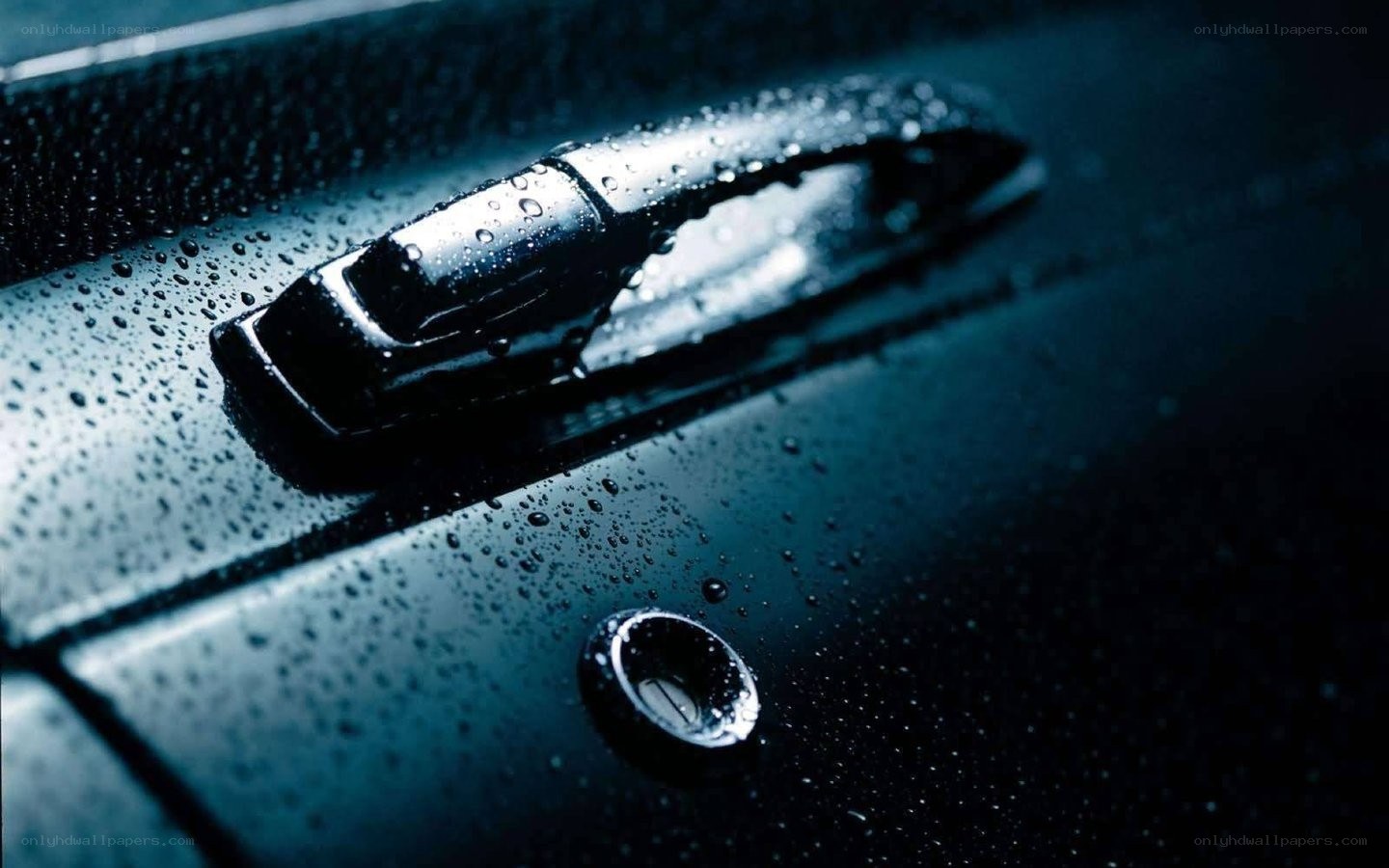 Car door handle with water droplets
