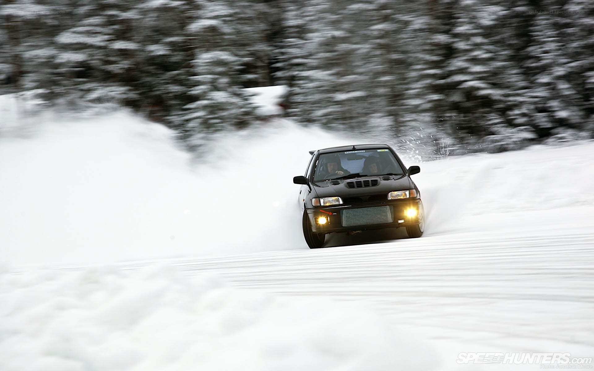 car drifting in snow
