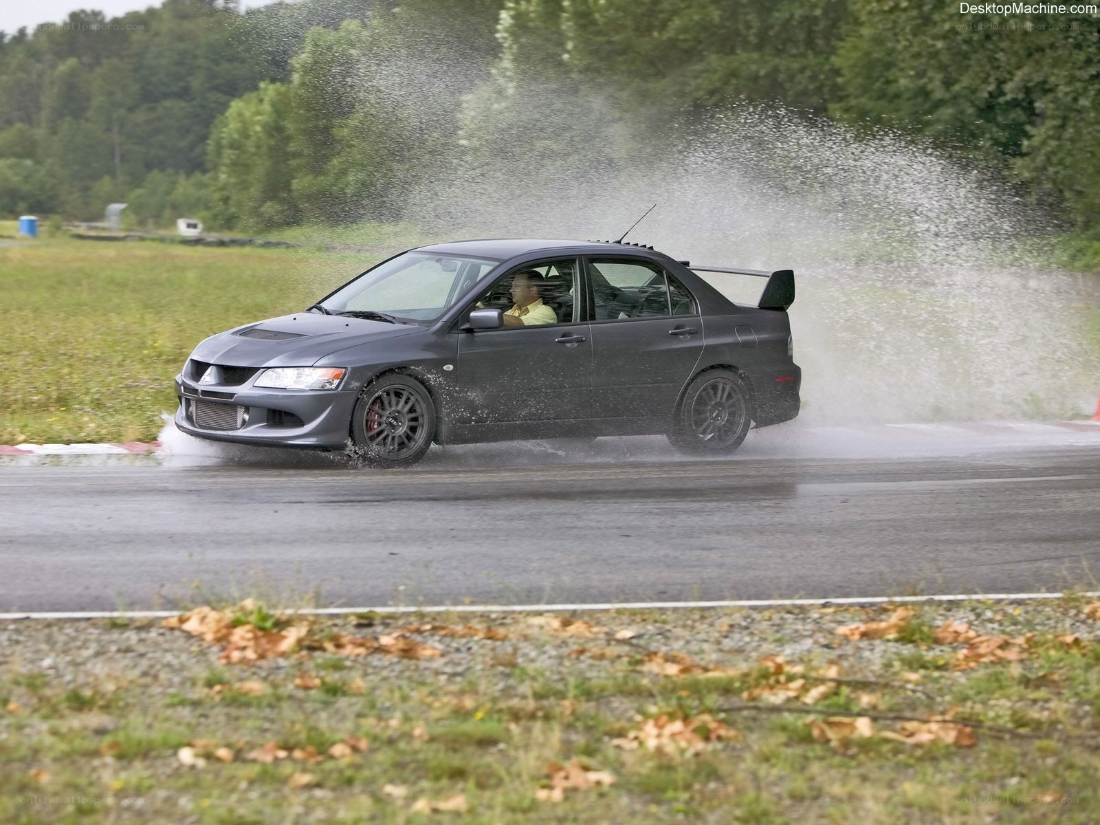 Car drifting in water spray