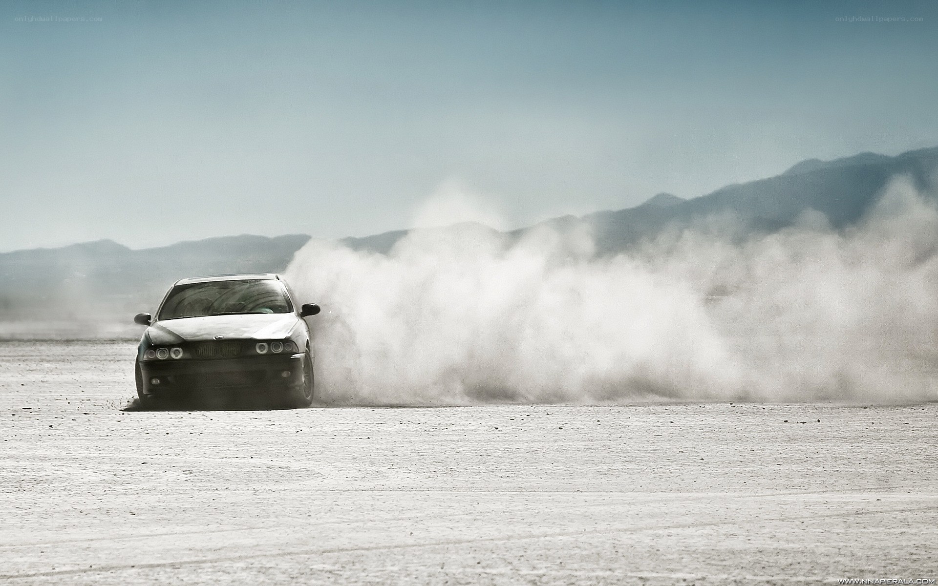car drifting on desert plain