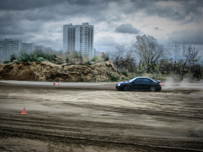 Car drifting on dirt track