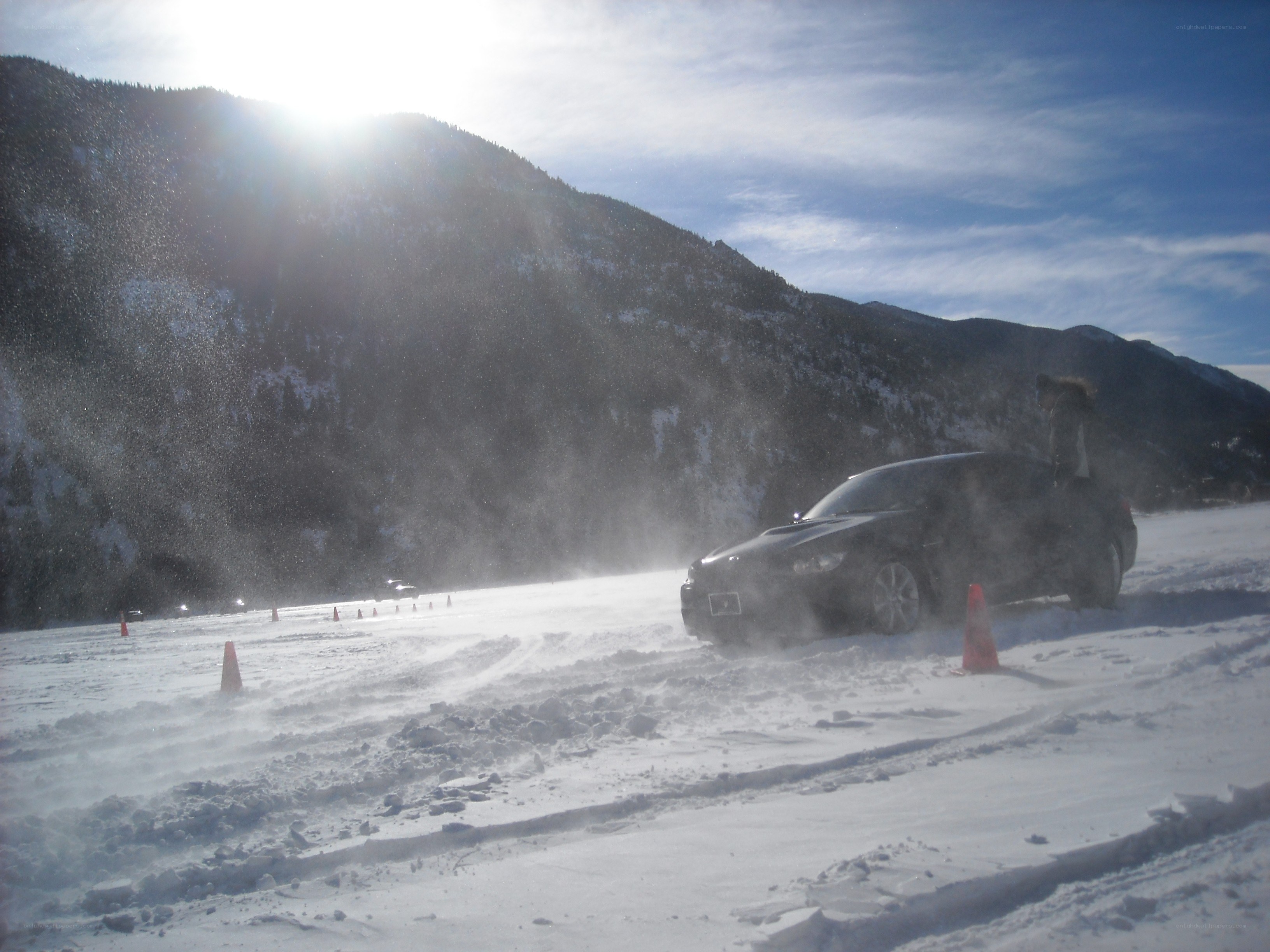 Car drifting on snowy mountain