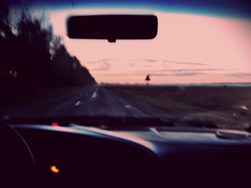 Car Driving at Dusk — Purple