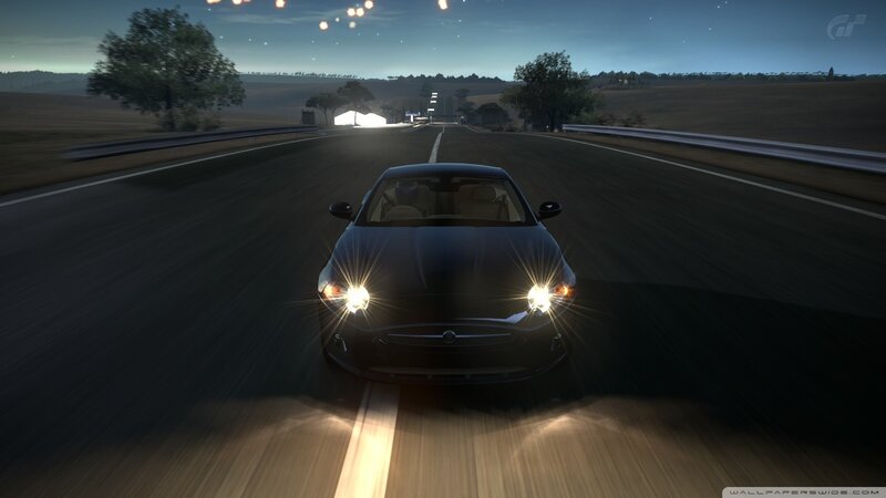 car driving at night on a road