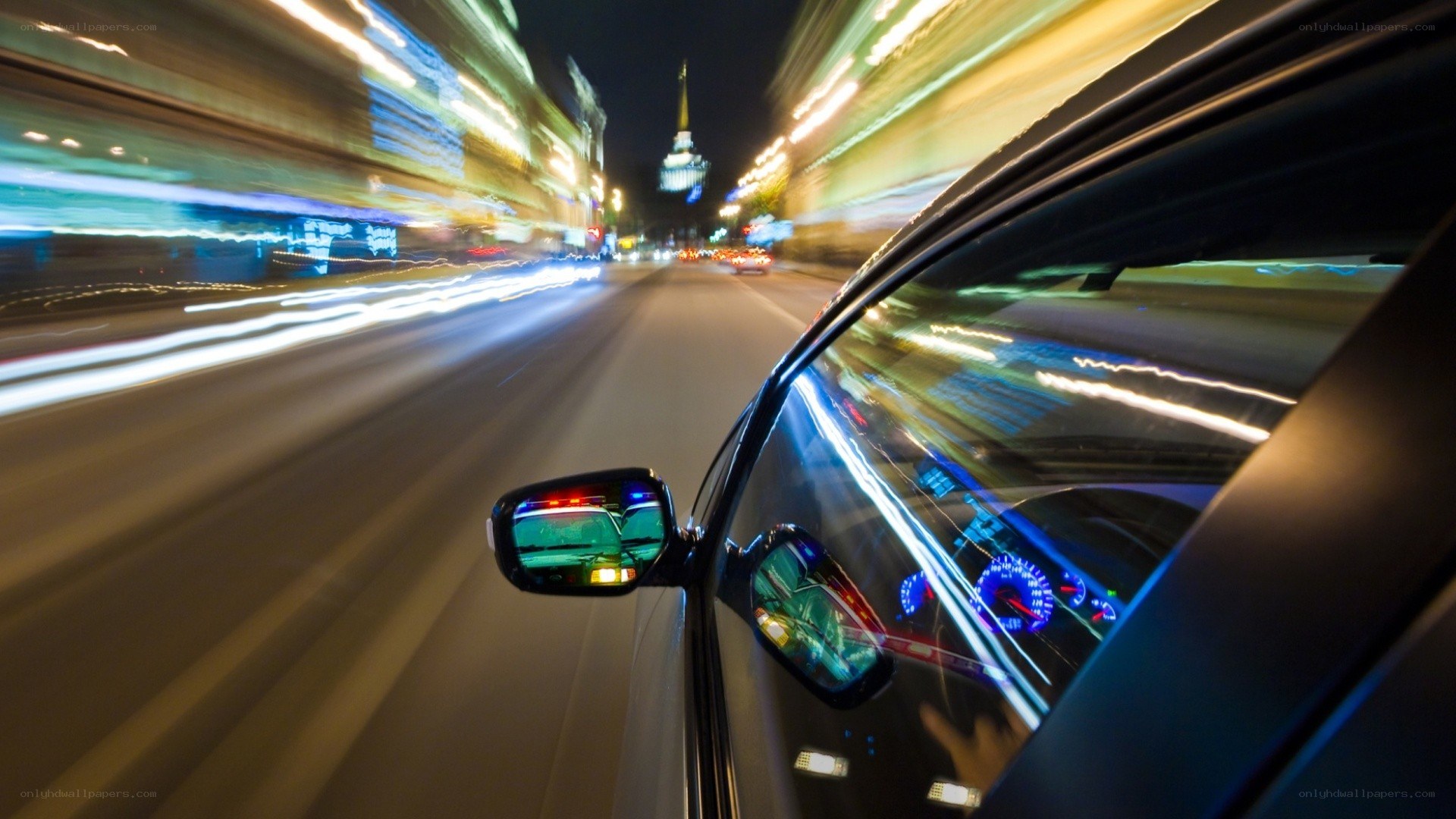 car driving at night with light trails