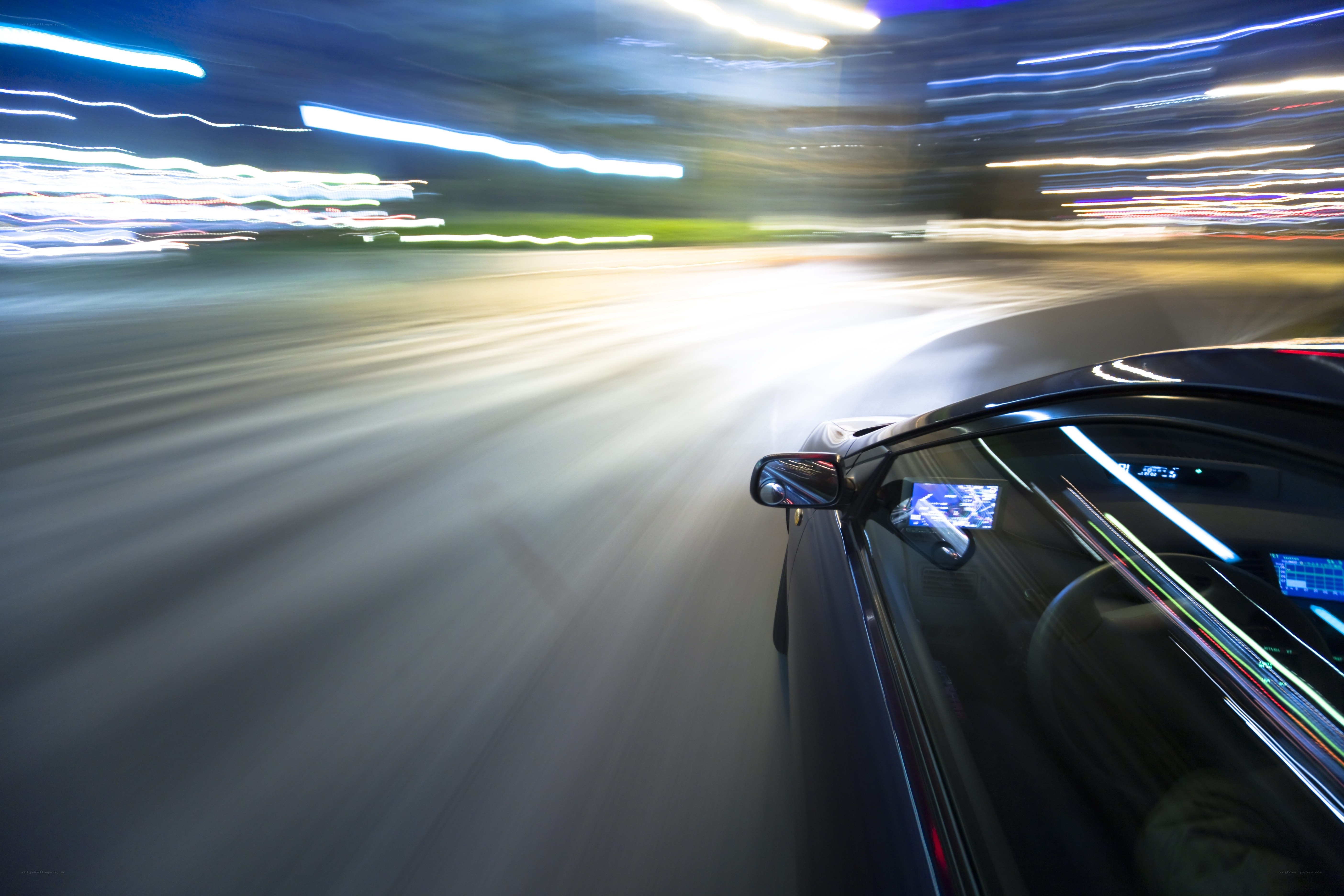 car driving at night with light trails