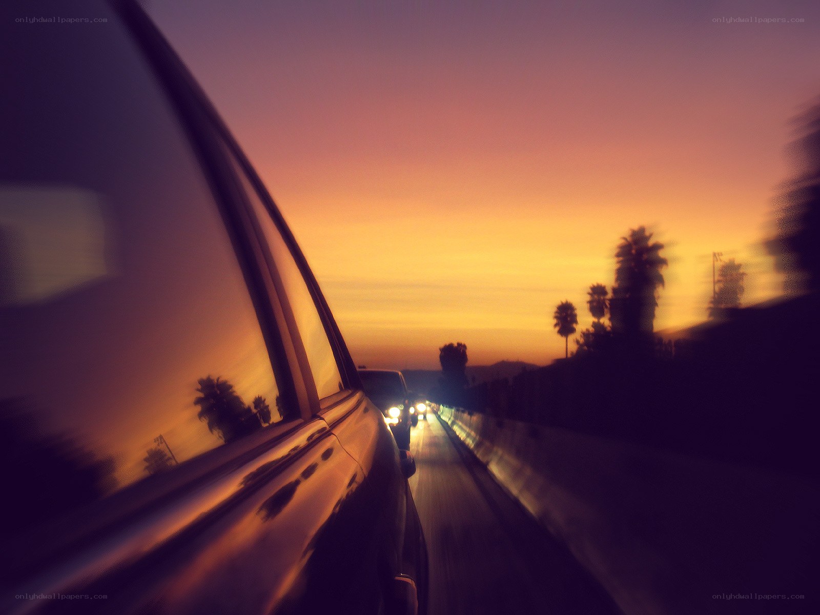 car driving at sunset