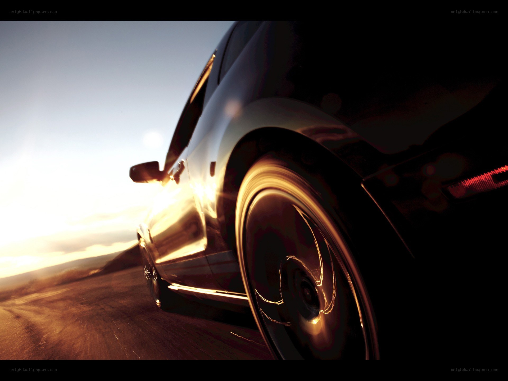 car driving at sunset
